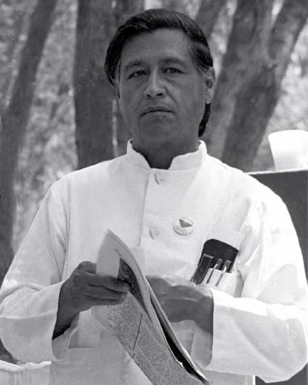 Cesar Chavez holding a newspaper