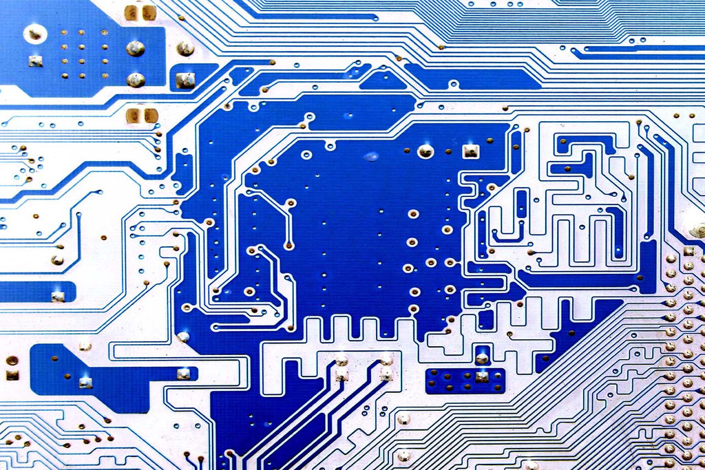 Photo of a blue computer circuit board.