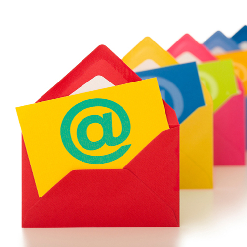 A long line of brightly colored envelopes, each with a card inside with the "at" symbol on it.