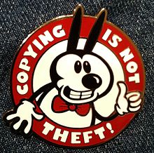 Pin with a Mickey-Mouse look-alike and the words "Copying is not Theft!" written around the edge.