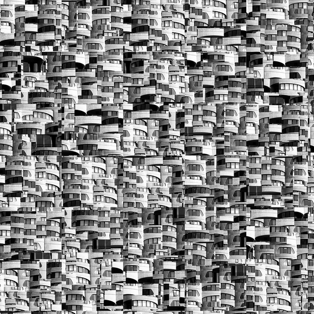 Picture composed of fragments of black-and-white photographs that have been rearranged to form an intricate "building."