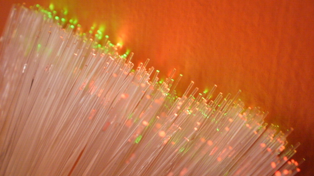Photo of fiber optic cables, orange background.