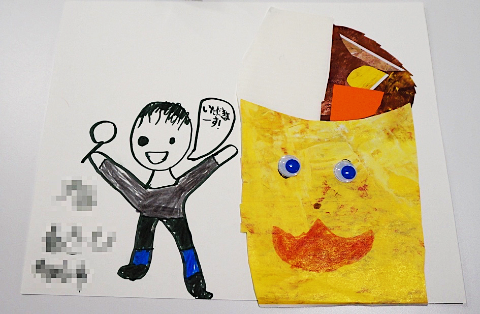 child's artwork with a figure of a boy and a bowl of Japanese curry