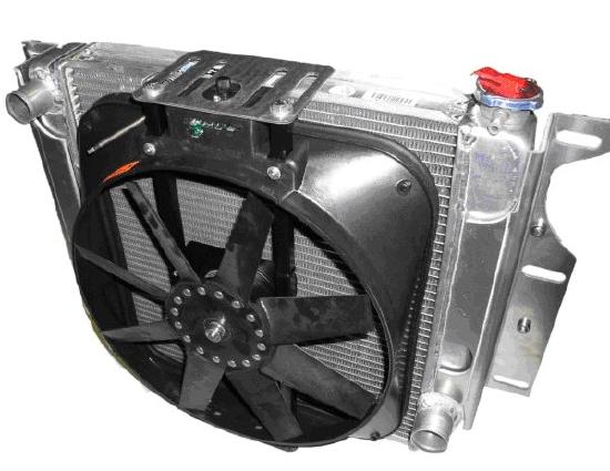 A metal car radiator with a large black fan attached, featuring various inlets and outlets for coolant.