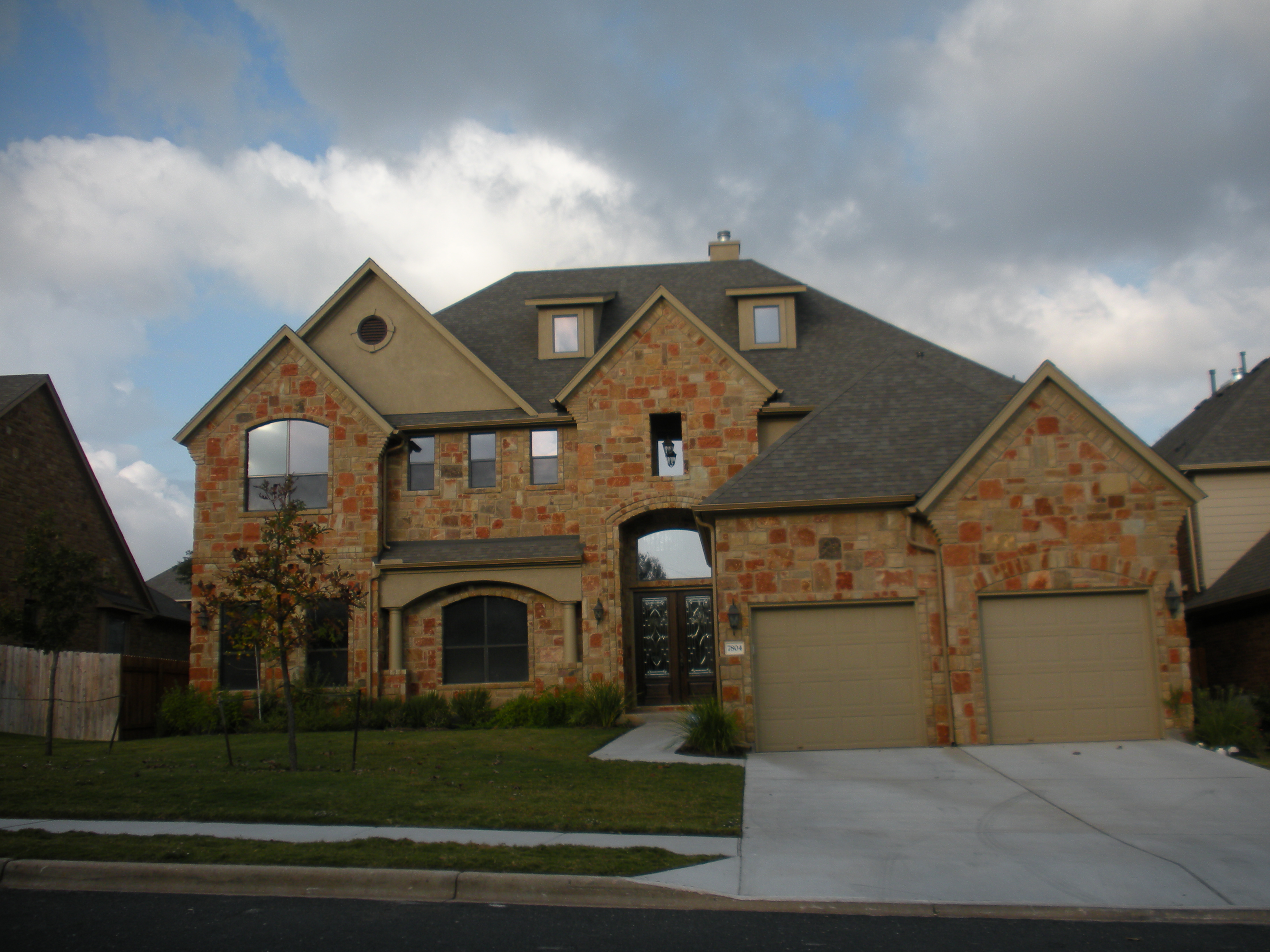 Exterior of a modern home with complex roof design