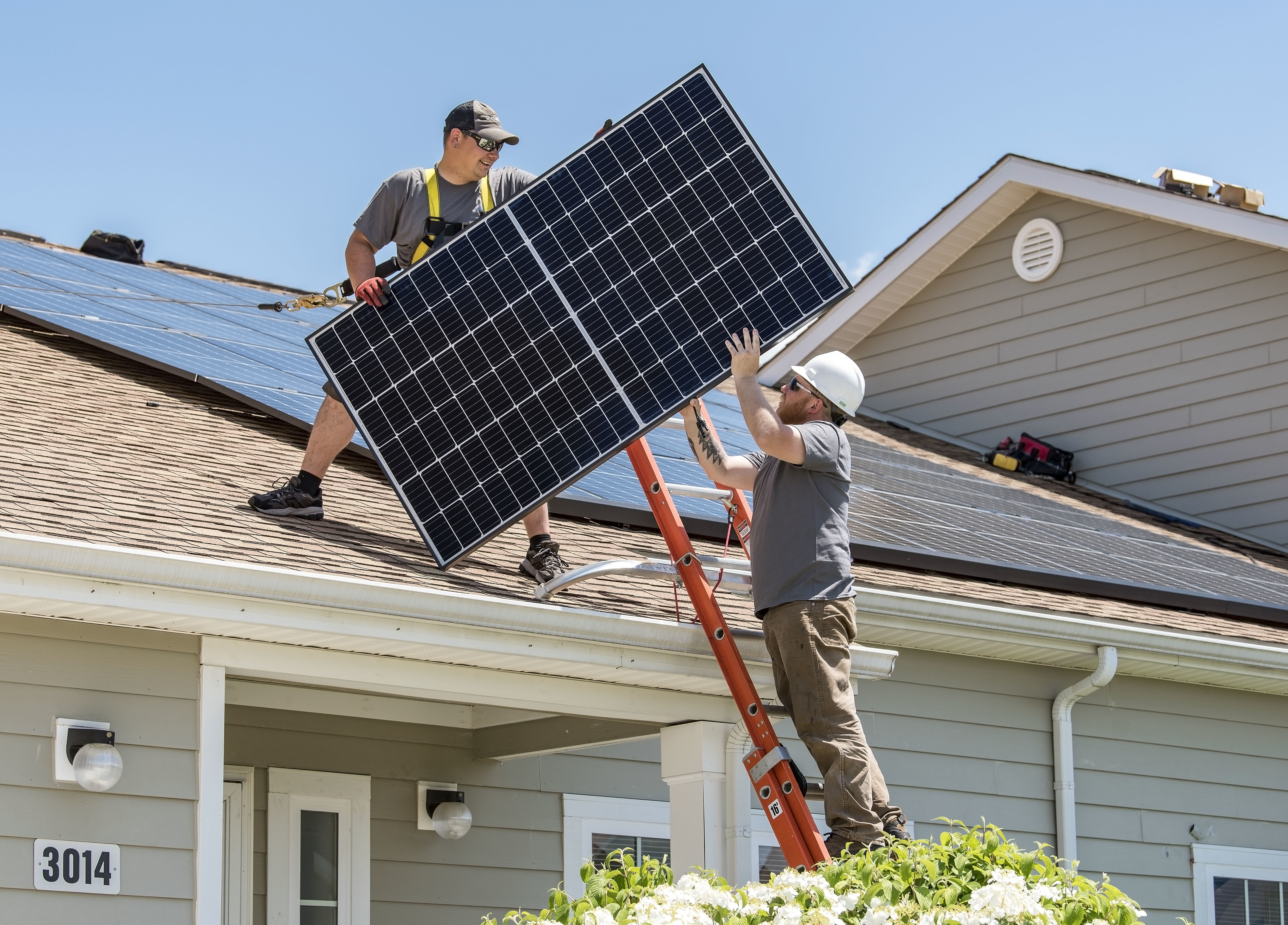 Solar panel installation on roof of modern home