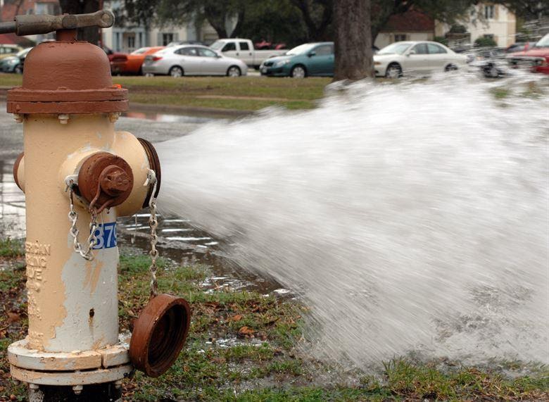 A fire hydrant gushes water onto the streets of Barksdale Air Force Base, La., Jan. 31. The 2nd Civil Engineer Squadron opened the hydrant, in order to troubleshoot flooding issues. (U.S. Air Force photo/Airman 1st Class Joseph A. Pagan Jr.)(RELEASED)