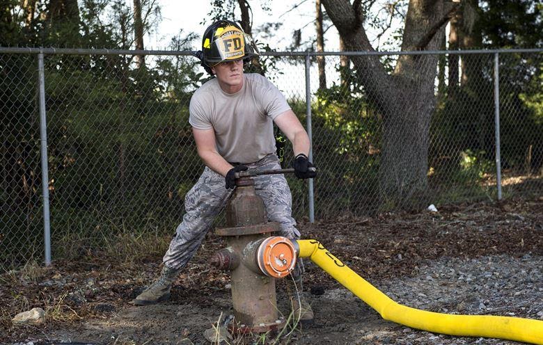 U.S. Air Force Airman Jacob Molden, 23d Civil Engineer Squadron firefighter, closes a fire hydrant during a joint live fire training exercise, Aug. 24, 2016, at Moody Air Force Base, Ga. After the firetrucks deplete their water supply, theyâ€™re refilled by the on-site hydrant.  (U.S. Air Force photo by Airman 1st Class Janiqua P. Robinson)