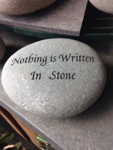A stone with writing "nothing is written in stone"